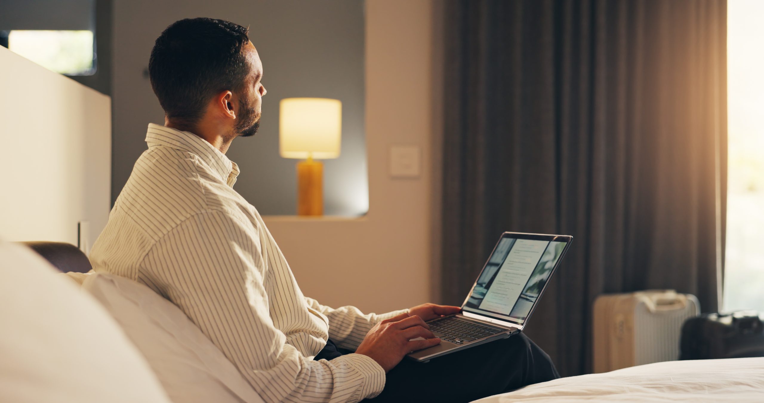 Traveller comparing hotel booking rates on a laptop